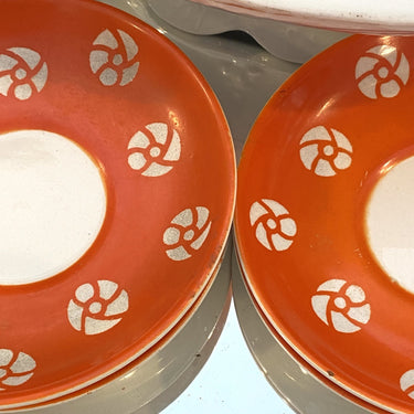 Saucer - Petrus Regout - belongs to cup model CLARY (design Johan Lint) - orange with white, stylized, flowers
