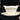 Gravy boat – cream with gold rim – round shape with two pouring spouts.