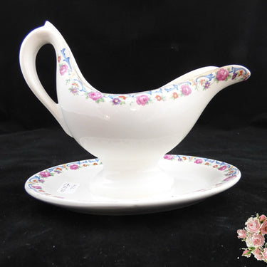 Sauciere aus Keramis mit Rosenrand und blauen und violetten Blumen