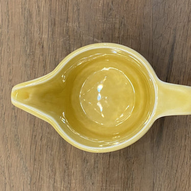 Milk jug - Pillivuyt France - in ochre yellow with inscription in green