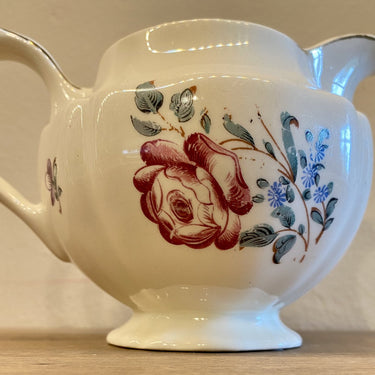 Milk jug - Petrus Regout - decor of red roses and a purple mark