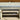 Hocker - cremefarbenes Holz mit Metallkante