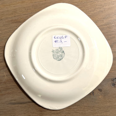 Platzteller - quadratisches Modell - Boch - Form VERFÜHRUNG? in Ockergelb ausgeführt