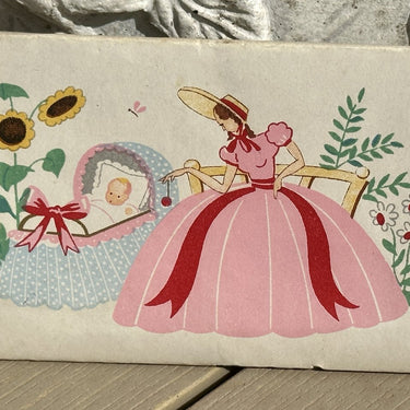 Baptism sugar box - with image of a lady with a hat in pink at a crib