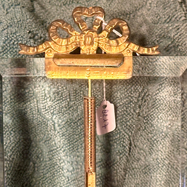 Picture frame / Photo frame - marked with Paris - with a bow at the top and thick glass with a bevelled edge - metal, brass?, standard with ball feet and bow