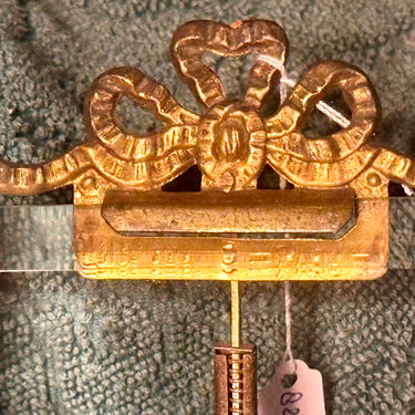 Picture frame / Photo frame - marked with Paris - with a bow at the top and thick glass with a bevelled edge - metal, brass?, standard with ball feet and bow