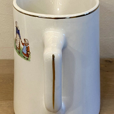 Milk jug - Moulin des Loups - decor of cow, women, children and a dog