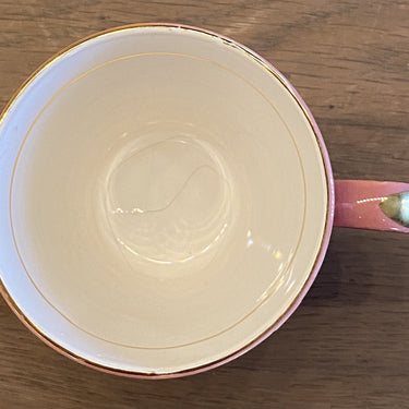 Kopje - ongemerkt - donkerroze met goudkleurige sterretjes en een goudkleurig lijntje in het kopje